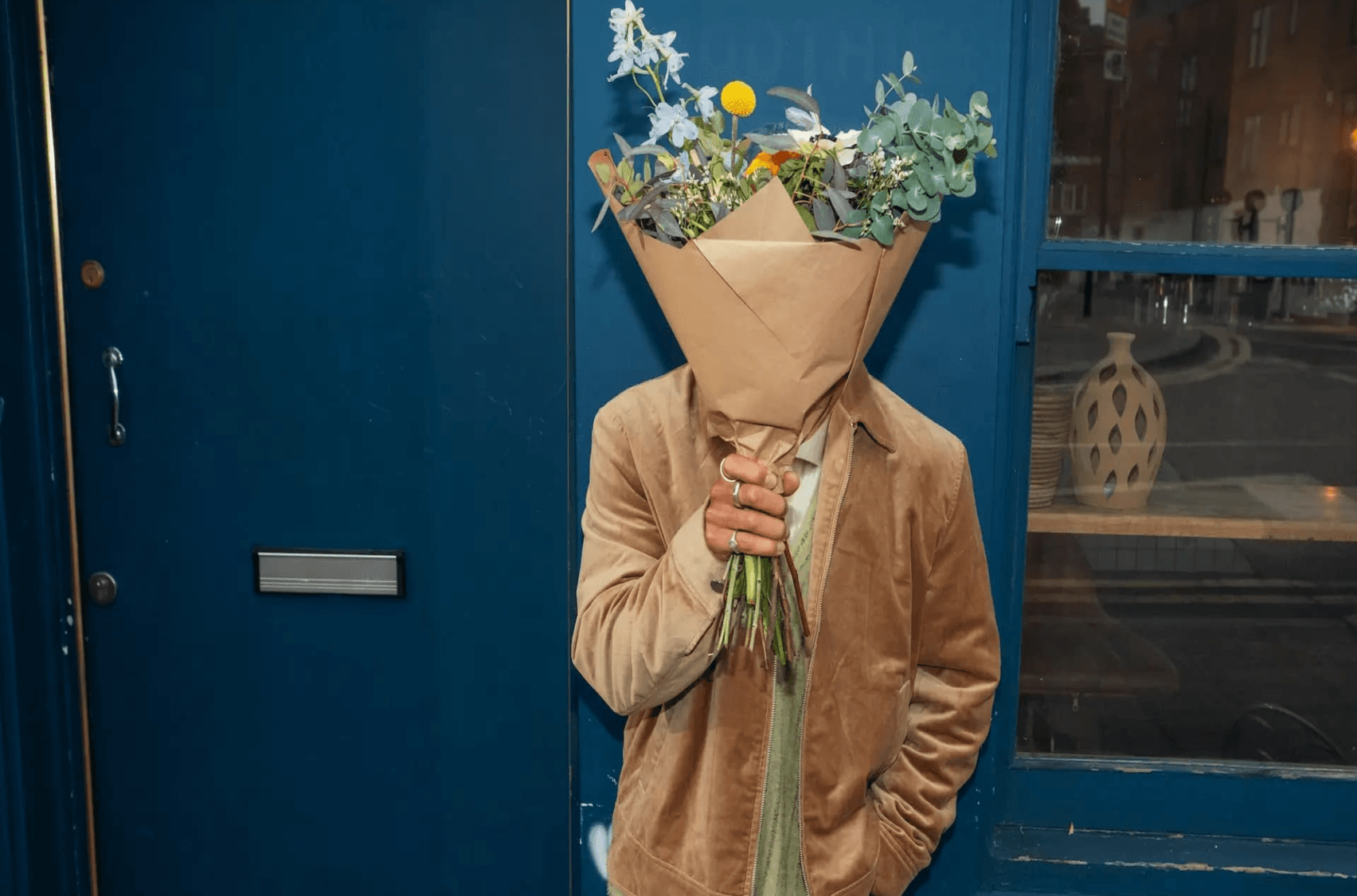 Person holding a bouquet of flowers